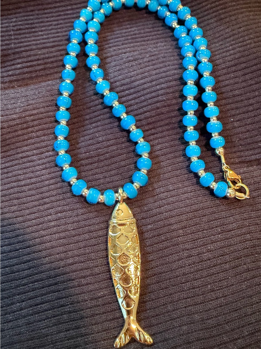 Imported from Italy. Blue Glass Bead Necklace with Gold Fish Pendant -